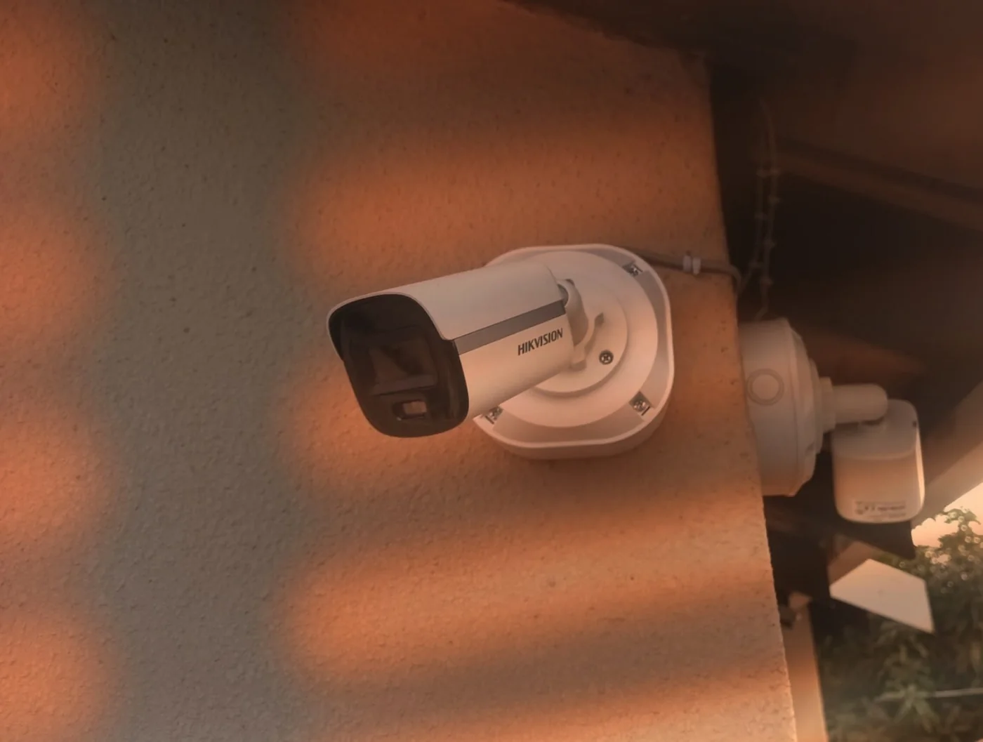 Hikvision CCTV camera installed on an exterior wall