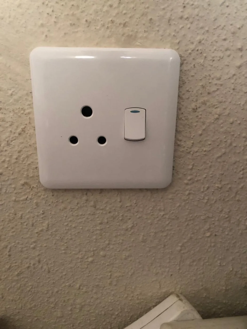 Installed white electrical wall socket